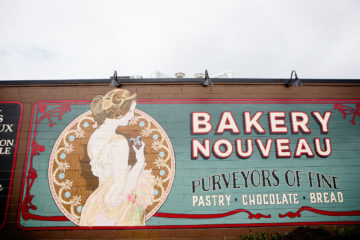 Bakery Nouveau mural on the outside wall at the Burien location